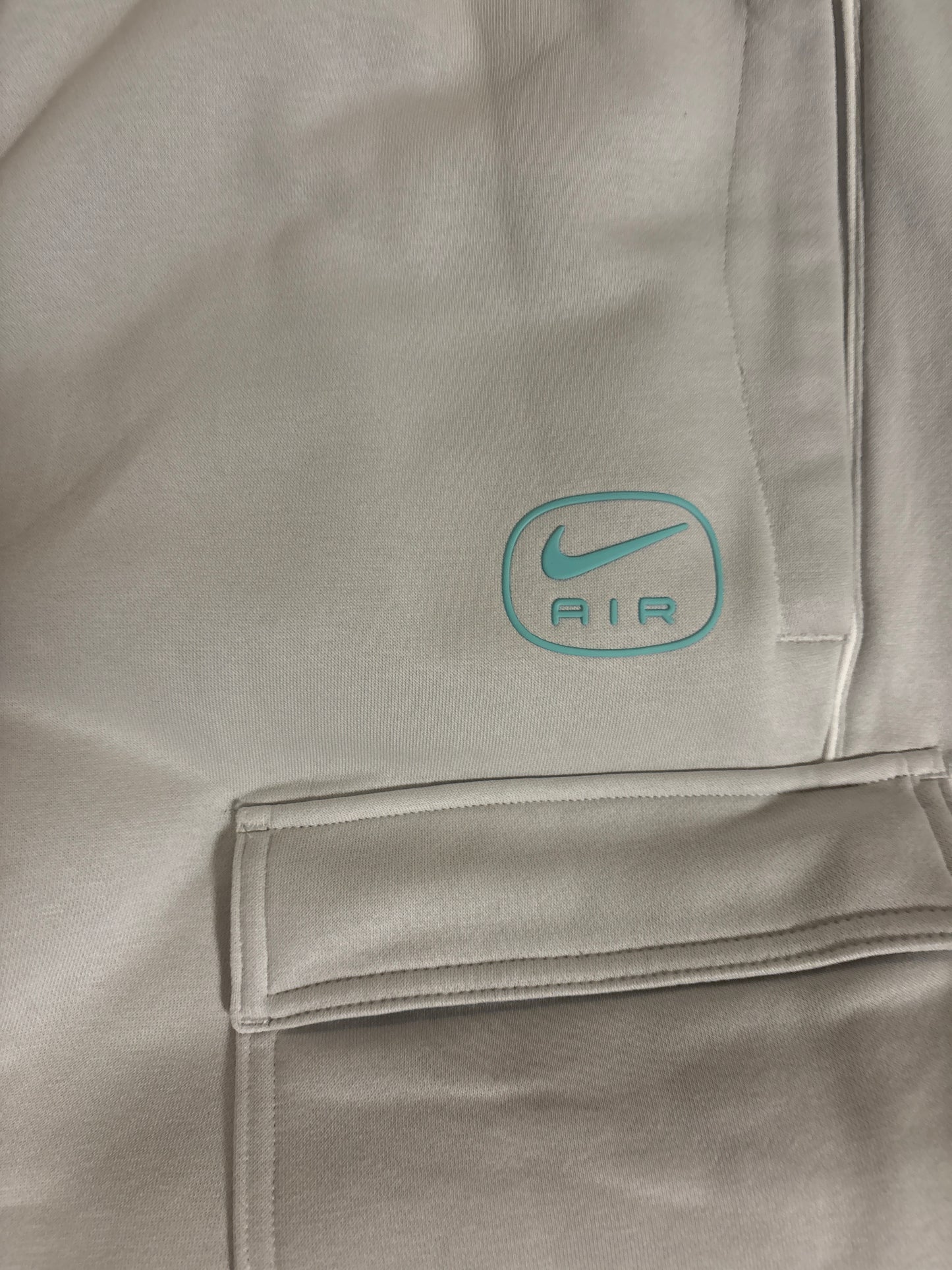 Nike Air Cargo Jogginghose, grau/türkis, Größe wählbar