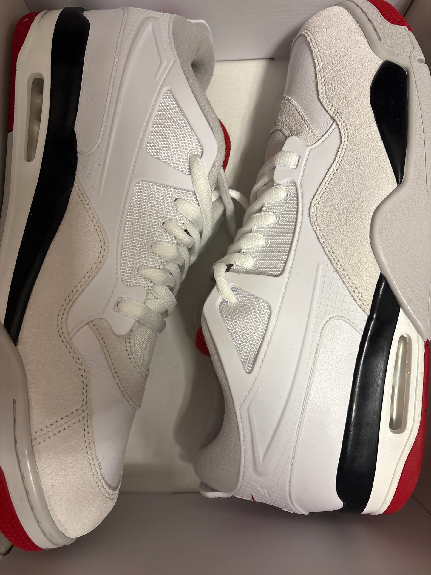 Nike AIR Jordan 4 RM in schwarz/weiss/rot, Größe 49,5