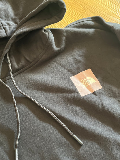 The North Face Damen Hoodie in schwarz mit Backprint in rosa, Größe wählbar