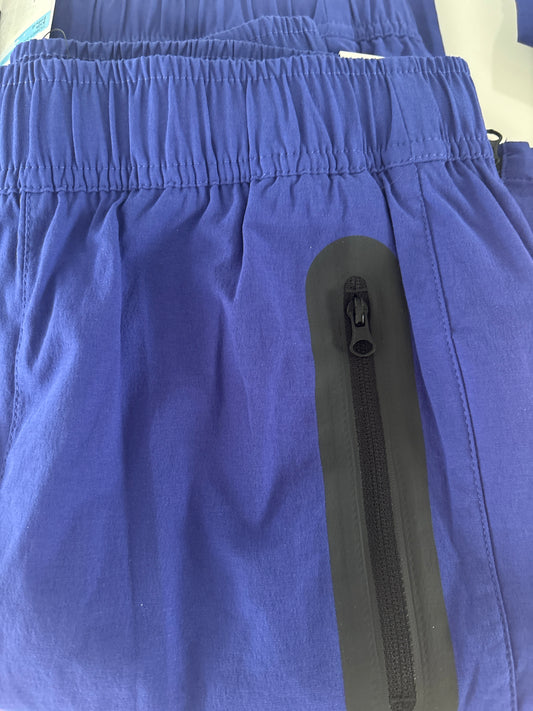 Nike Kinder Windbreakerhose in dunkelblau, Größe wählbar