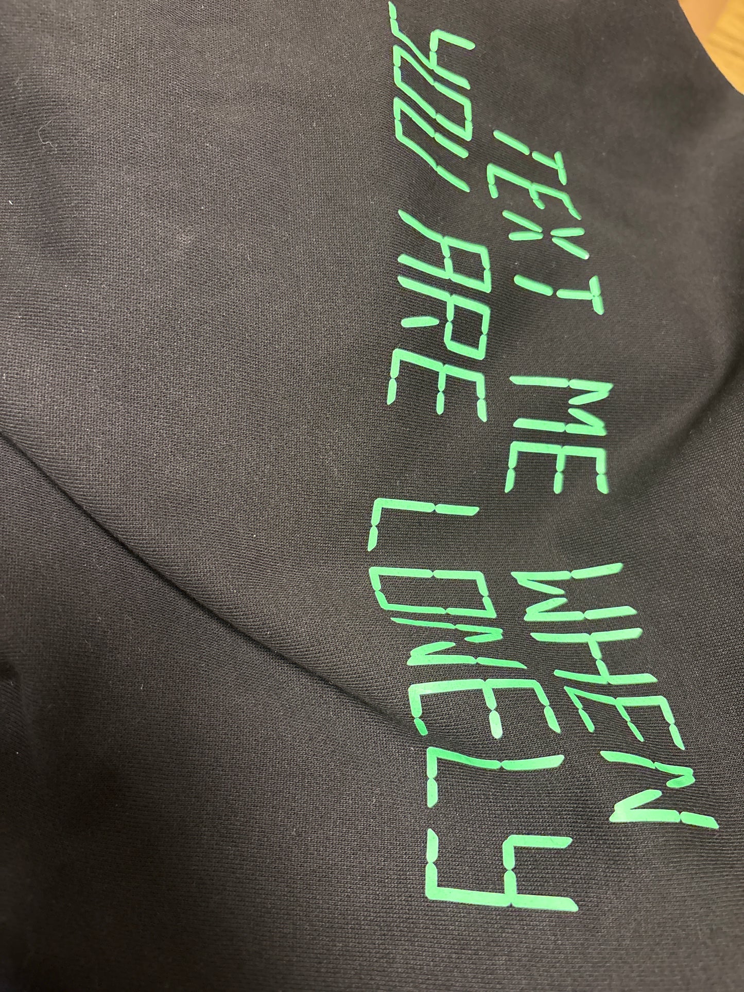 Pegador Hoodie in schwarz mit grüner Schrift, Größe XL